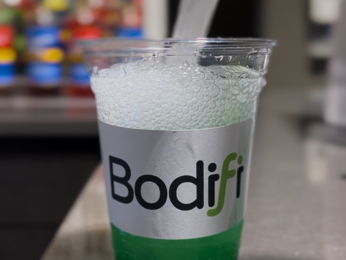 Premium amenities at Bodifi Gym in Idaho Falls. Featuring tanning beds, a protein shakes bar, a supplement shop, gym apparel, red light therapy, JOOV therapy, and massage chairs for a comprehensive fitness and wellness experience.